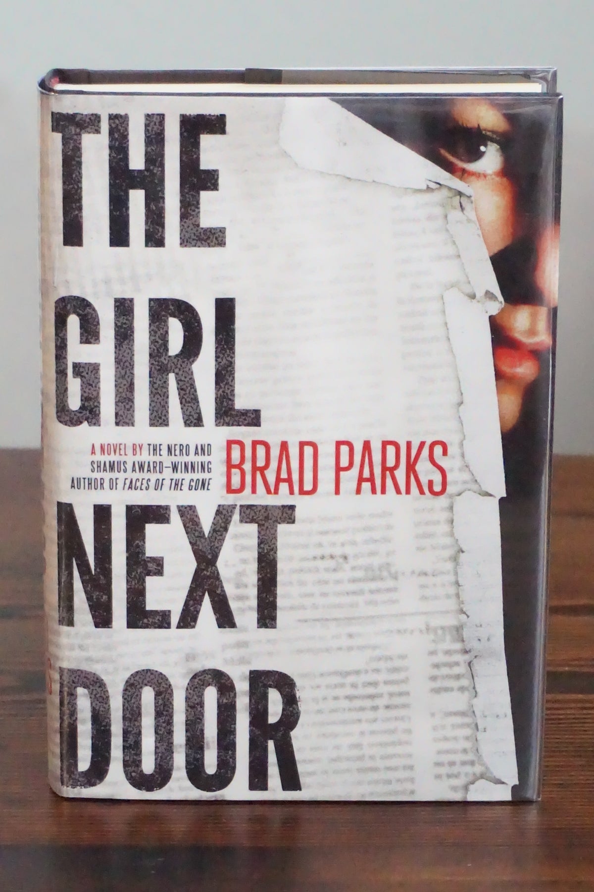 The Girl Next Door by Brad Parks 2012 First Edition Hardcover Carter Ross